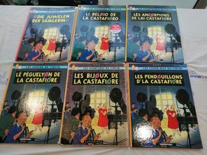 Des albums des "Bijoux de la Castafiore", avec l'édition en patois montcellien en bas à droite.